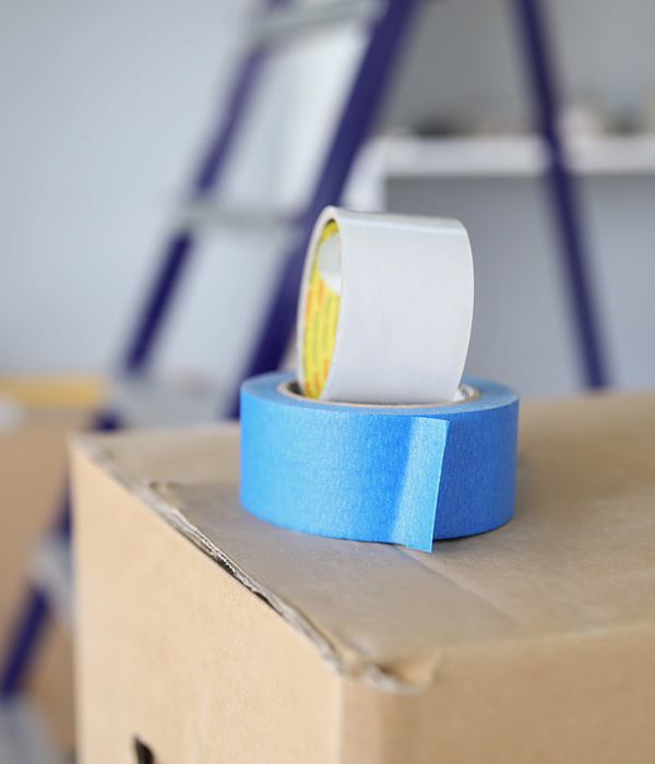empty boxes and a stepladder in a room